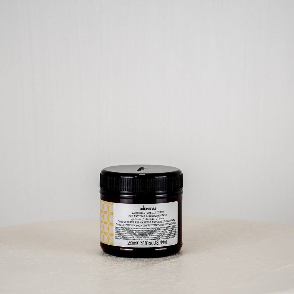 Jar of Davines hair product on a light gray background