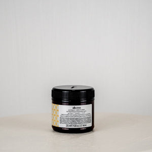 Jar of Davines hair product on a light gray background
