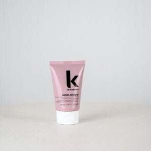 Pink tube of Kevin Murphy Angel Masque on a light gray background