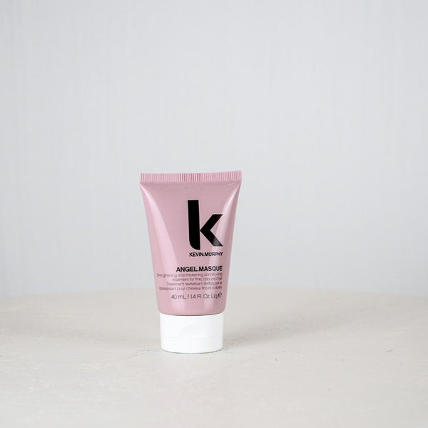 Pink tube of Kevin Murphy Angel Masque on a light gray background