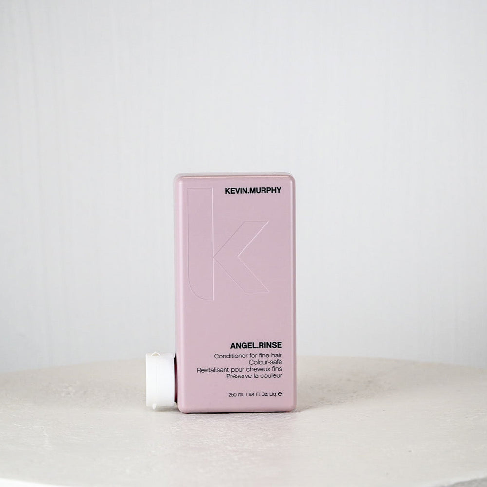 Kevin Murphy hair product packaging on a white surface with a light gray background