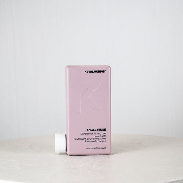 Kevin Murphy hair product packaging on a white surface with a light gray background