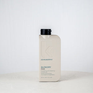 Kevin Murphy hair product bottle on a white surface with a white background
