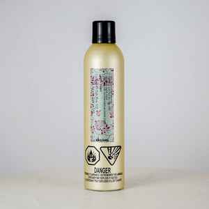 Bottle with a label on a white surface and gray background