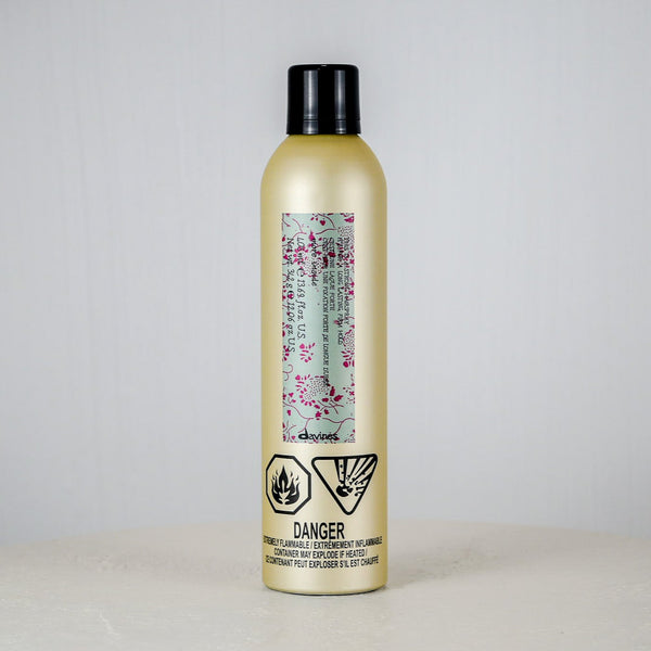 Bottle with a label on a white surface and gray background