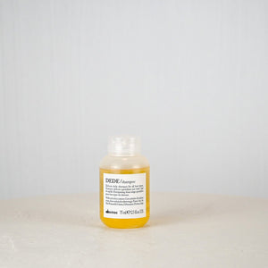 Bottle of DEIDE shampoo on a white surface with a light gray background