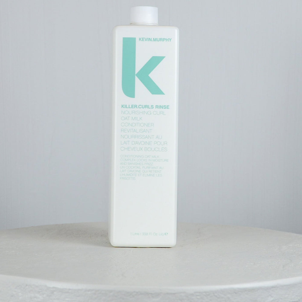 Kevin Murphy Killer Curls Rinse bottle on a white surface with a light gray background