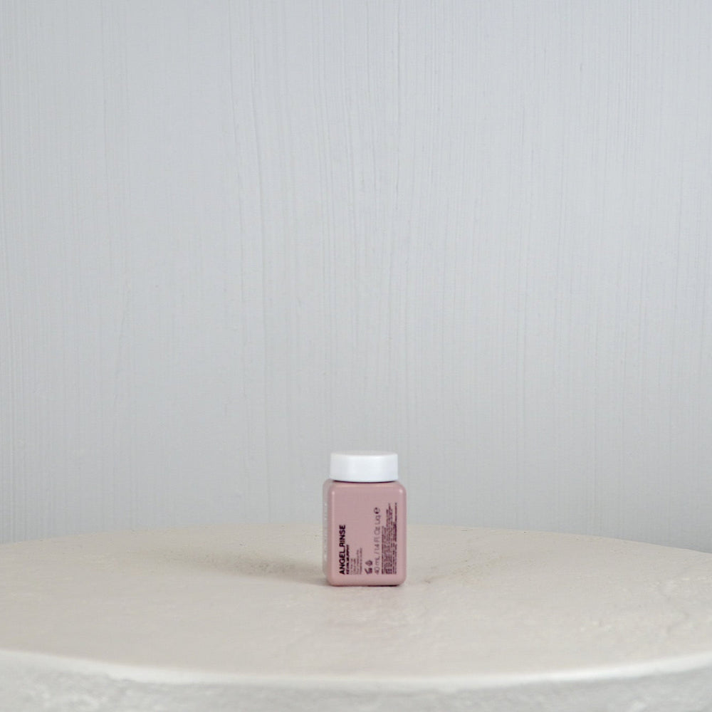 Kevin Murphy hair product packaging on a white surface with a light gray background