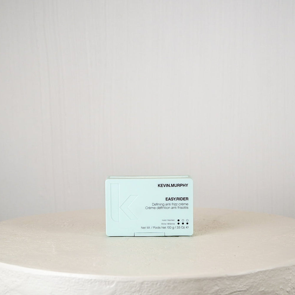 Business card on a round stone surface with a plain background