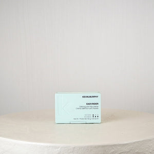 Business card on a round stone surface with a plain background