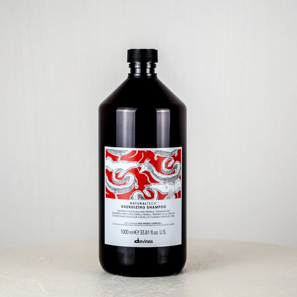 Bottle of Dầuit shampoo on a white background