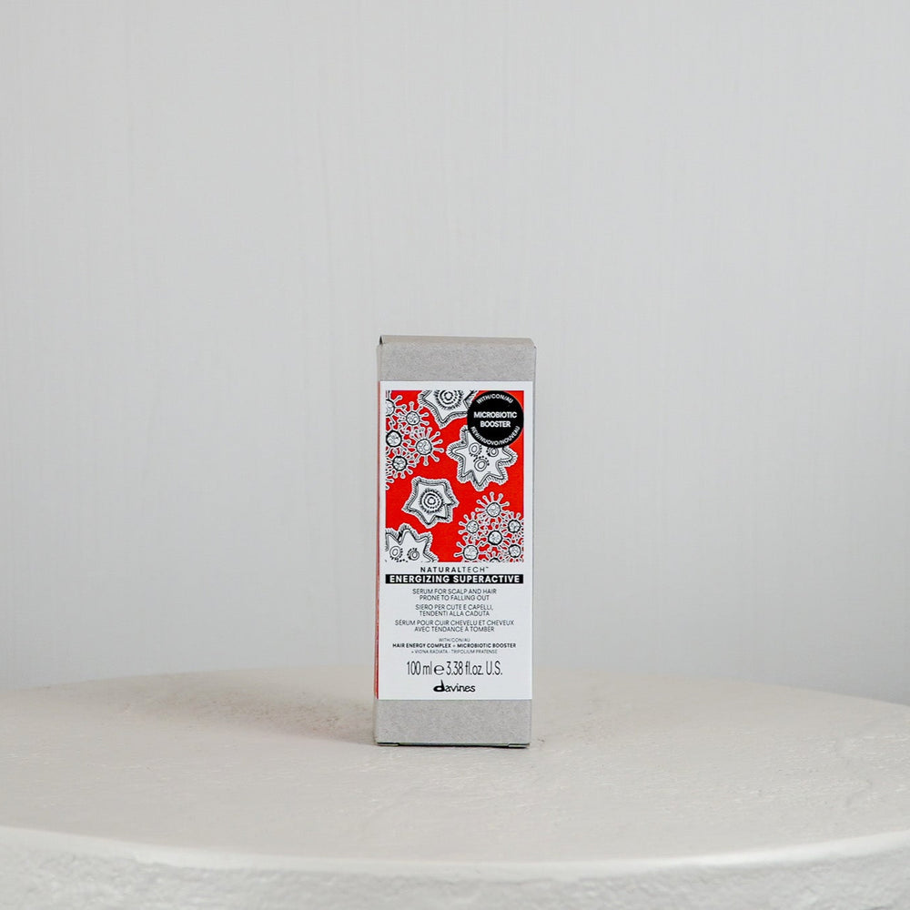 Dove soap bar on a white surface with a gray background