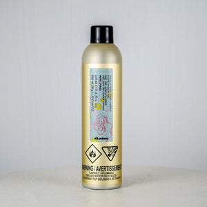 Gold bottle with a label on a gray background