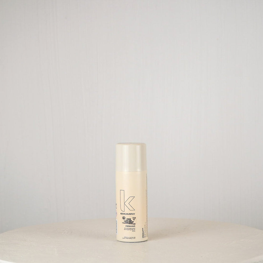 Kevin Murphy hair product bottle on a white surface with a light gray background