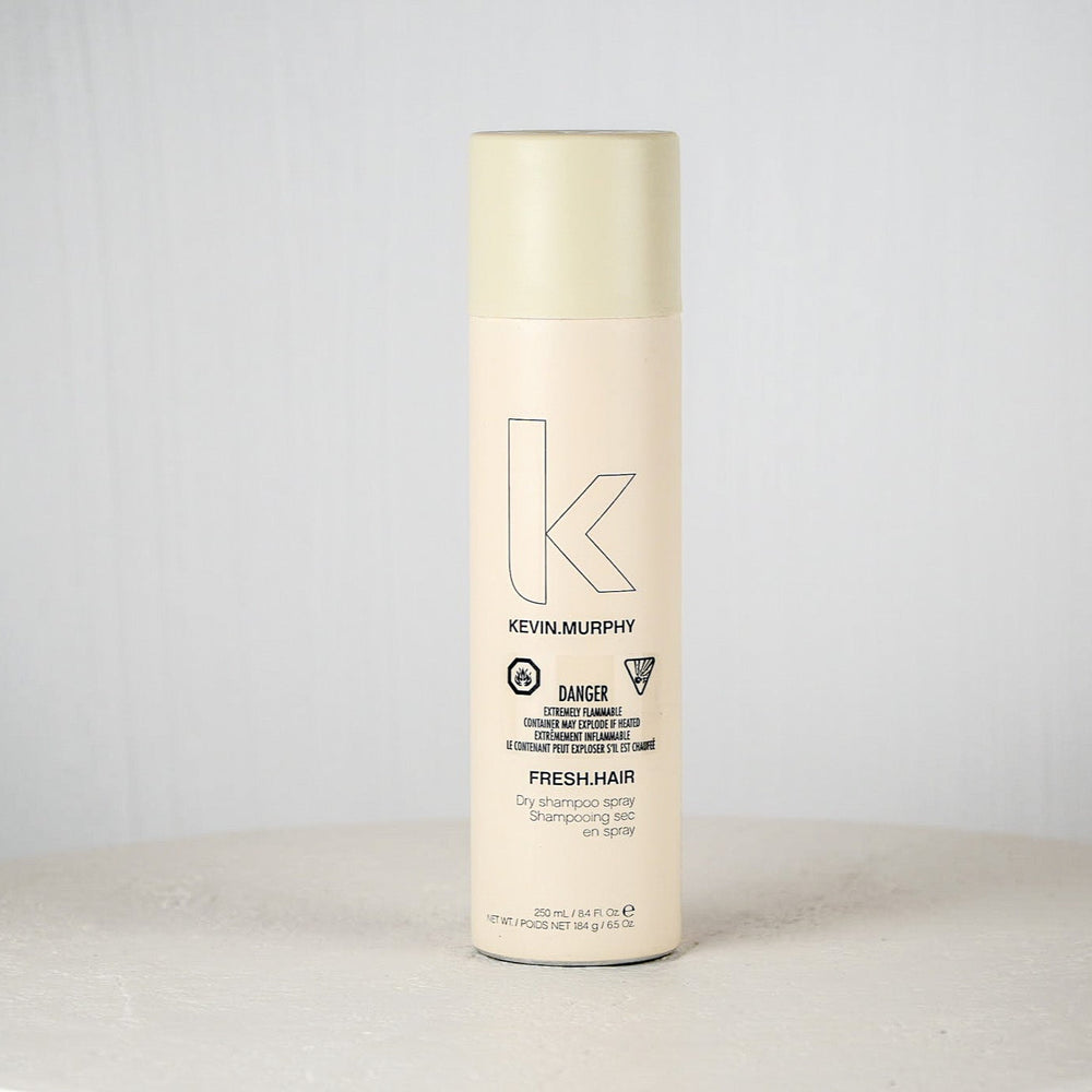 Kevin Murphy hair product bottle on a white surface with a light gray background
