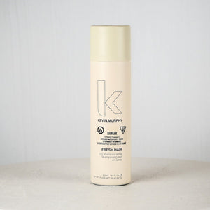 Kevin Murphy hair product bottle on a white surface with a light gray background