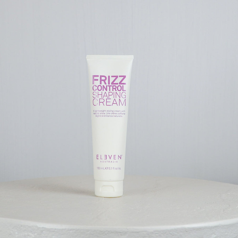 Tube of Frizz Control Shaping Cream by Eleven Australia on a light gray background