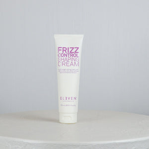 Tube of Frizz Control Shaping Cream by Eleven Australia on a light gray background