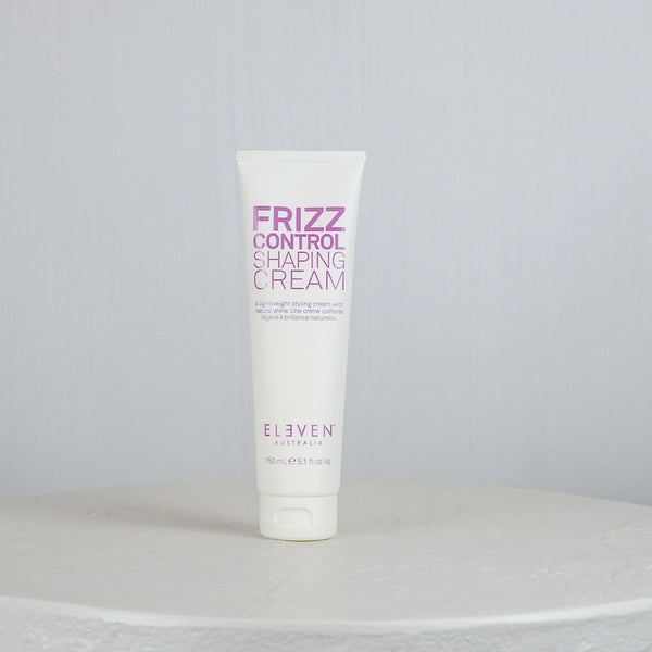 Tube of Frizz Control Shaping Cream by Eleven Australia on a light gray background