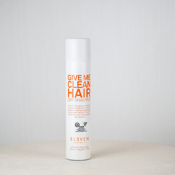 Shampoo bottle labeled 'Give Me Clean Hair' by Elvive on a white background
