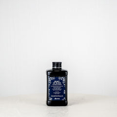 Bottle of Skinfood Heart of Grass Toner on a white surface with a white background