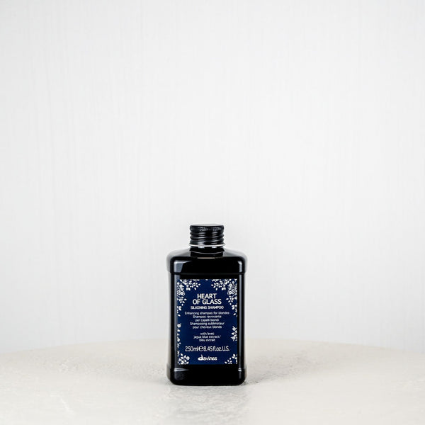 Bottle of Skinfood Heart of Grass Toner on a white surface with a white background