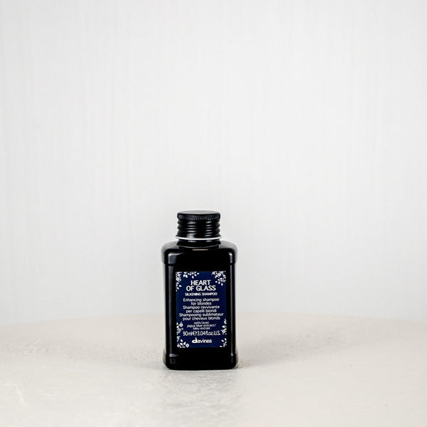 Black bottle with a label on a white background