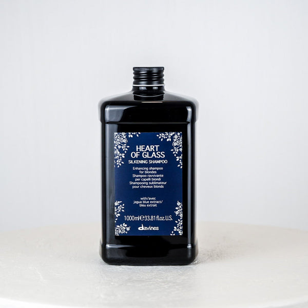 Shampoo bottle labeled 'Heart of Glass' by davines on a white background