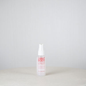 Spray bottle labeled 'I Want Body' on a white background