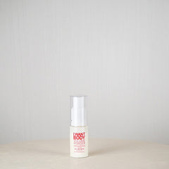 Skincare bottle labeled 'I Want Body' on a neutral background