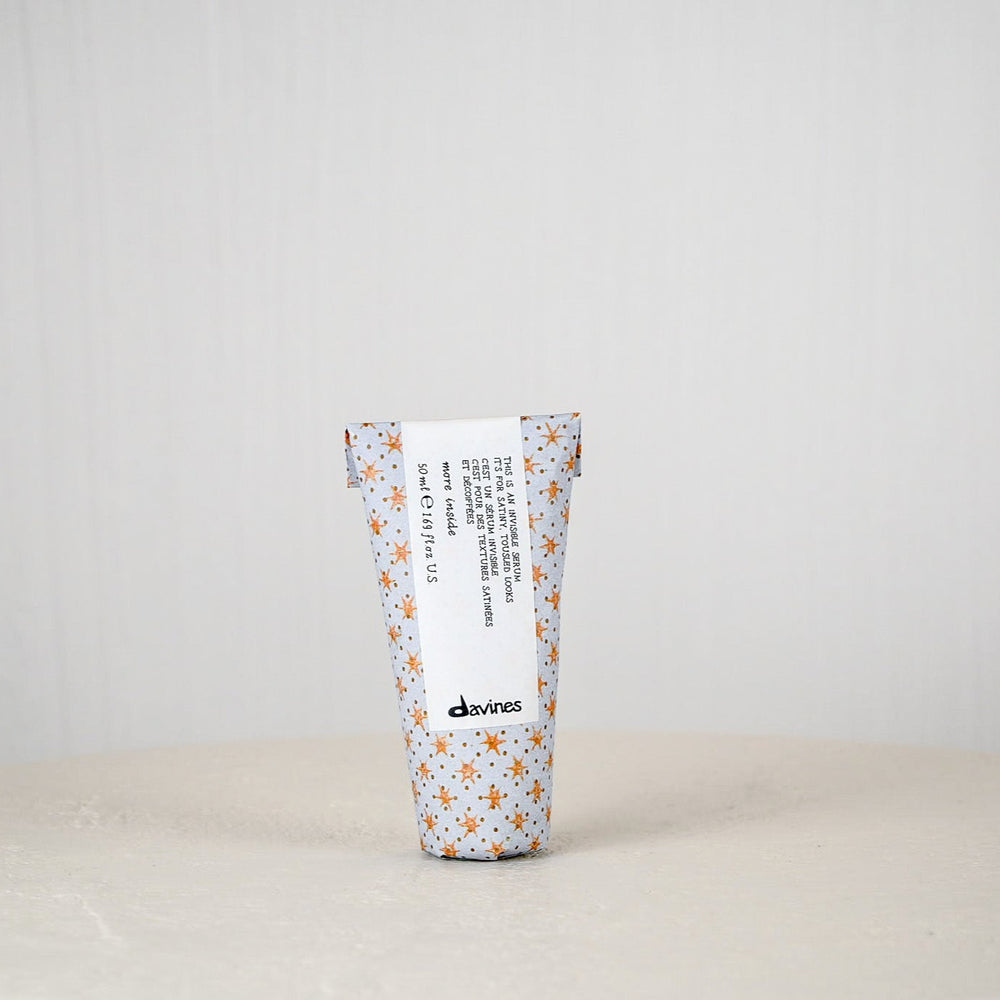 Tumbler with floral pattern and text on a white background