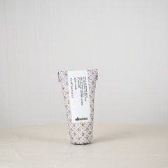 Tumbler with floral pattern and text on a white background