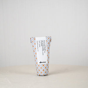 Tumbler with floral pattern and text on a white background