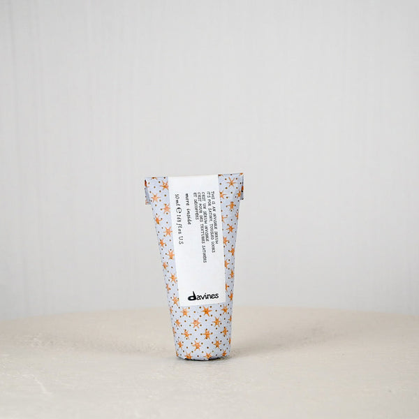 Tumbler with floral pattern and text on a white background