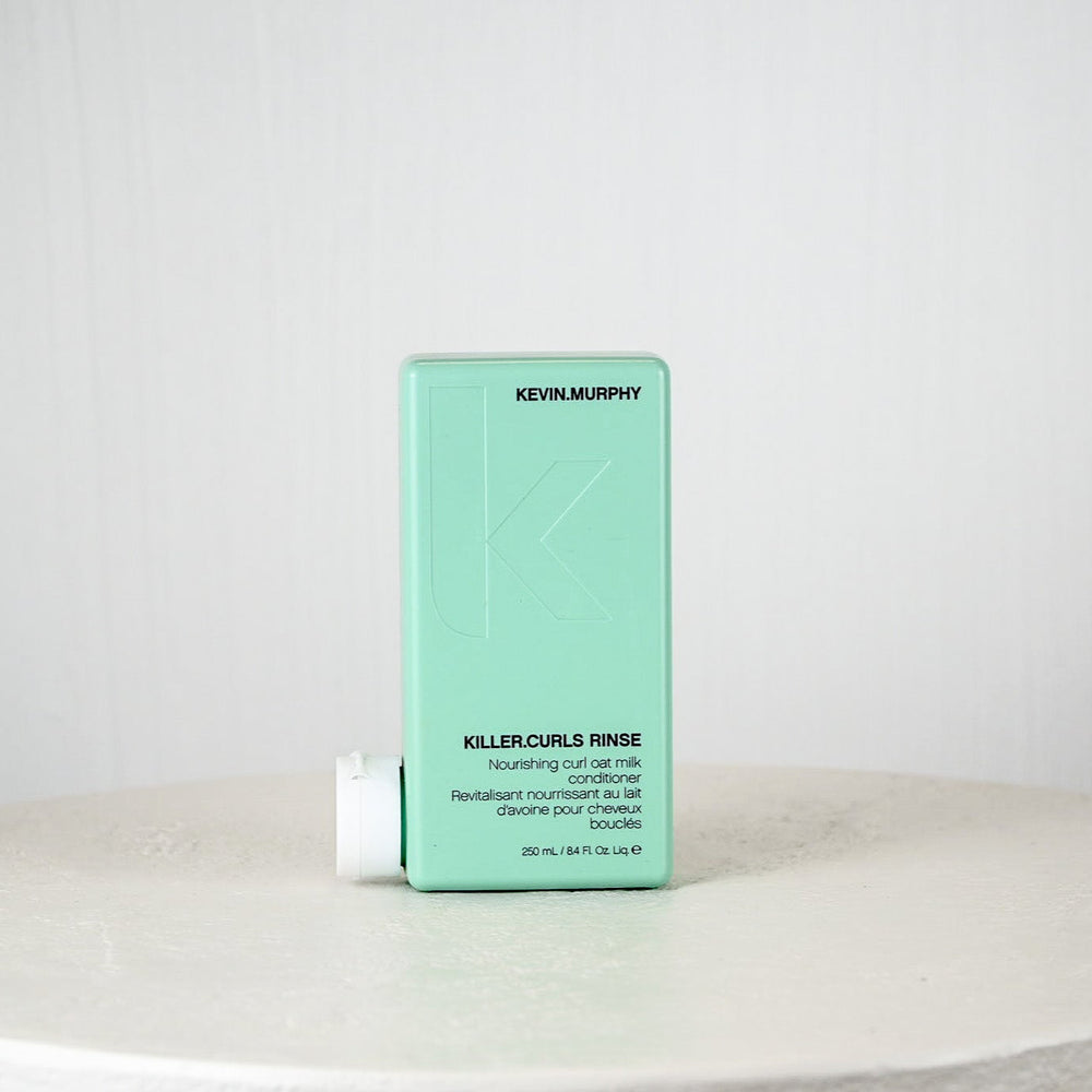 Kevin Murphy Killer Curls Rinse bottle on a white surface with a light gray background
