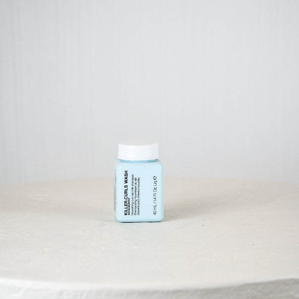 Kevin Murphy Killer Curls Wash packaging on a white surface with a light gray background