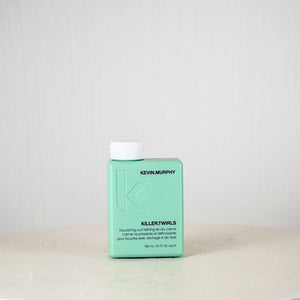 Kevin Murphy hair product bottle on a white surface with a light gray background