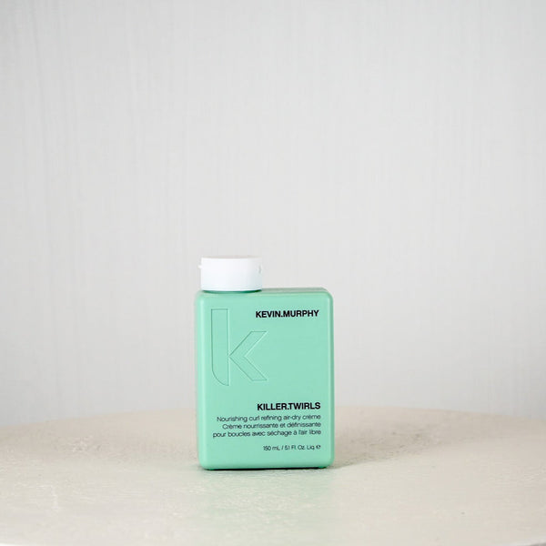 Kevin Murphy hair product bottle on a white surface with a light gray background