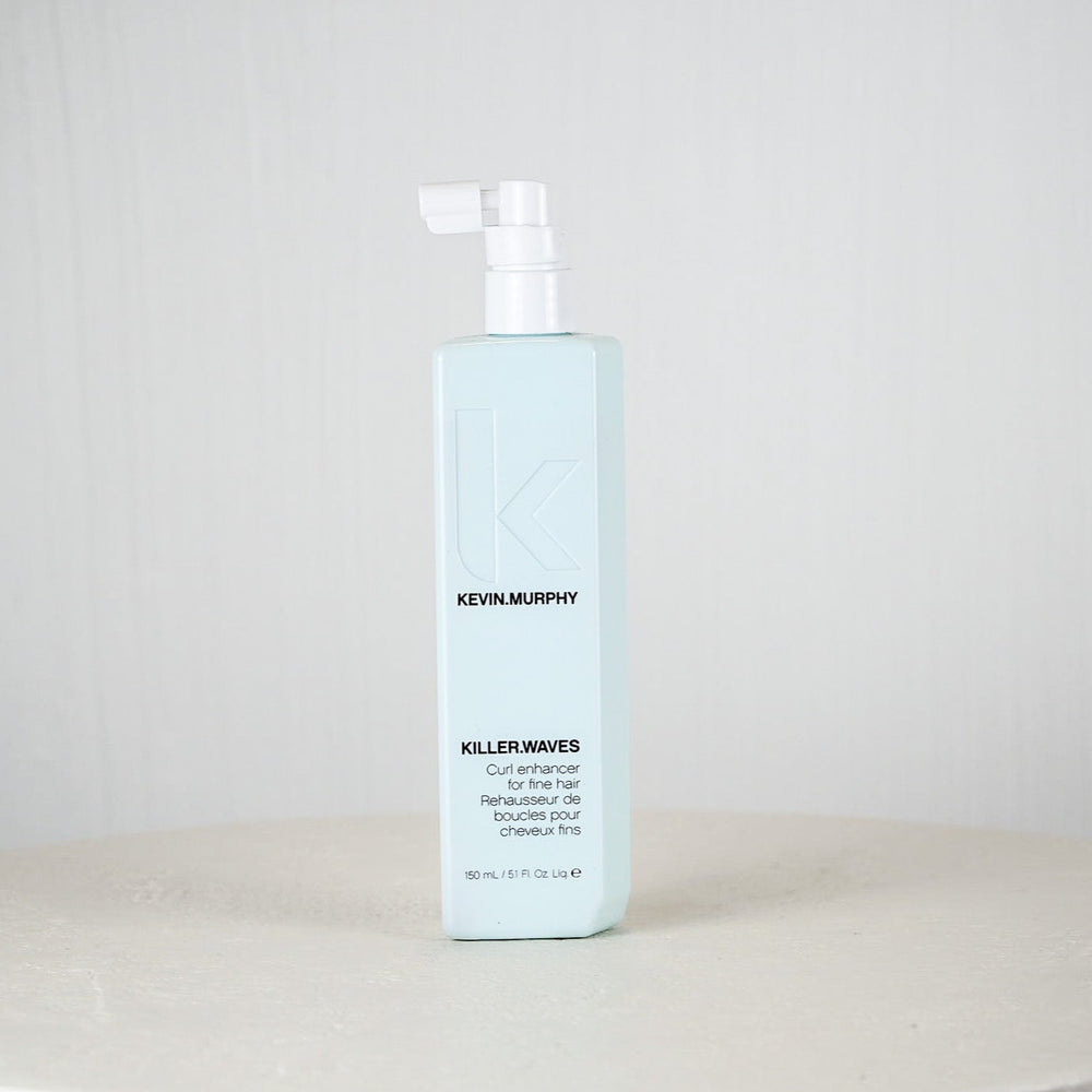 Kevin Murphy hair product bottle on a white surface with a light gray background