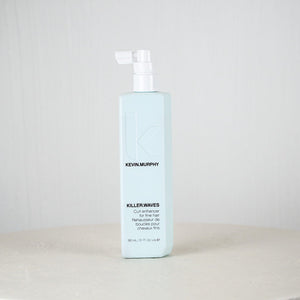 Kevin Murphy hair product bottle on a white surface with a light gray background