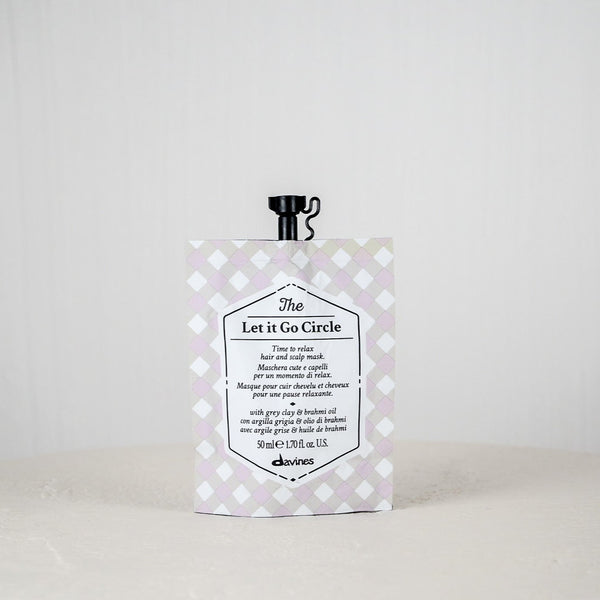 Skincare product packaging with text on a white background