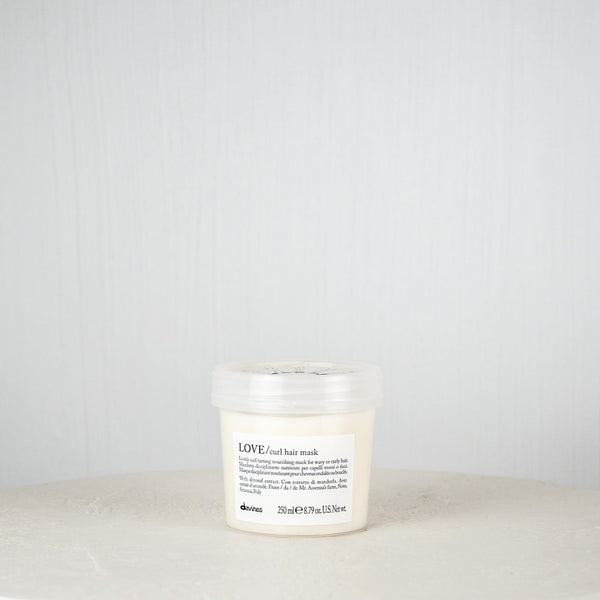 White hair mask jar with black text on a white background