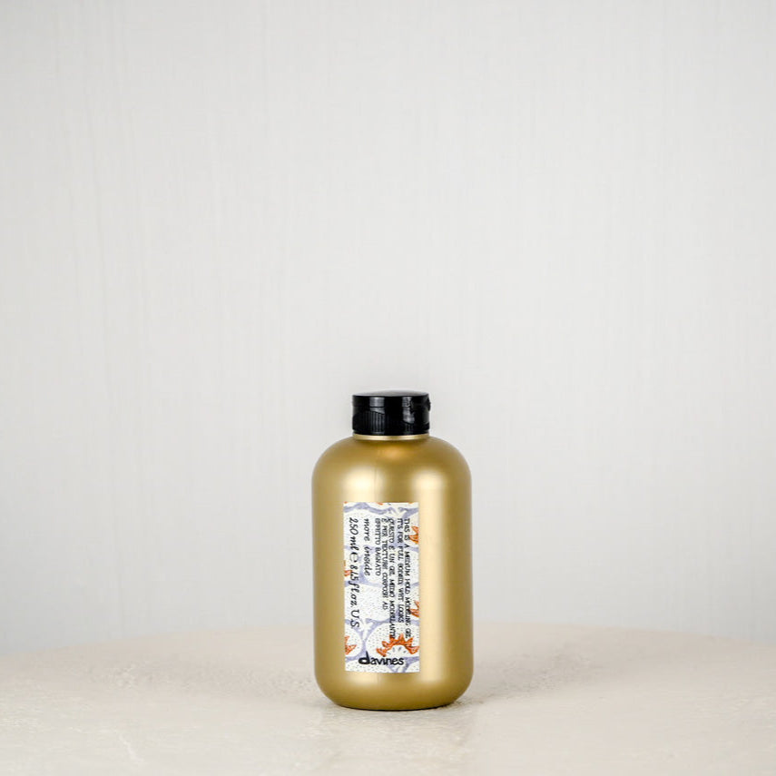 Davines hair product packaging on a neutral background