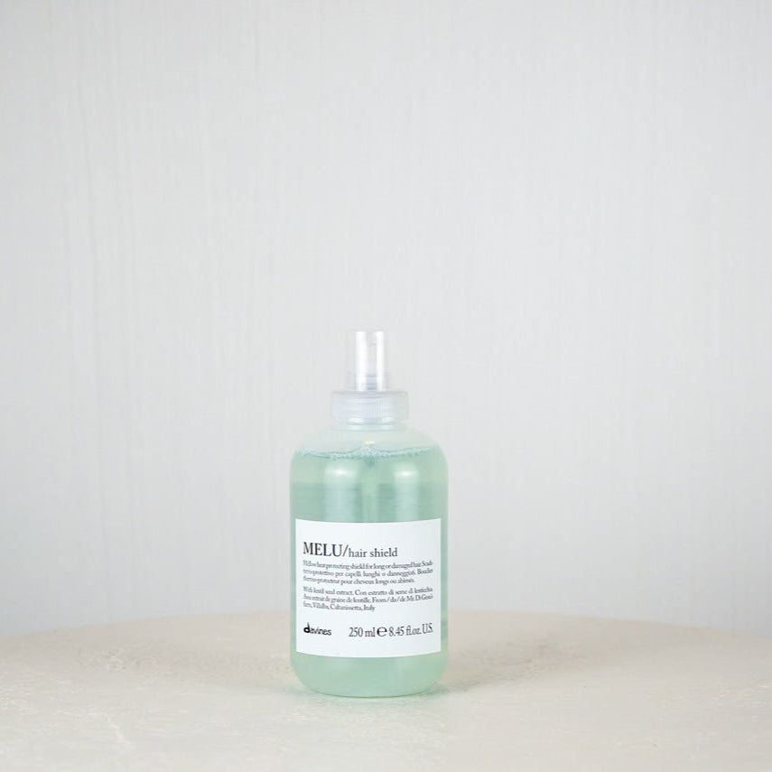 Bottle of Davines MELU hair product on a white background
