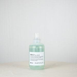 Bottle of Davines MELU hair product on a white background
