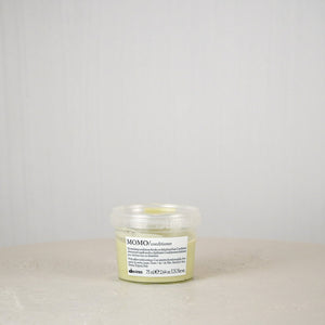 Jar of Momo Conditioner on a neutral background