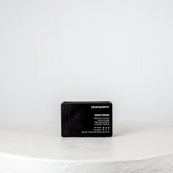 Black hair product packaging on a white background