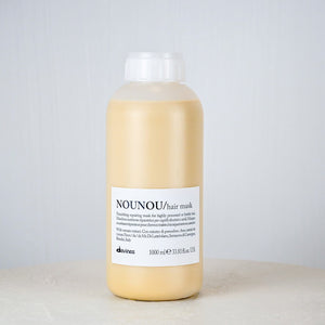 Bottle of NOUNOU hair mask on a light gray background