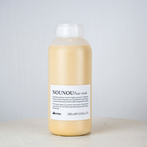 Bottle of NOUNOU hair mask on a light gray background