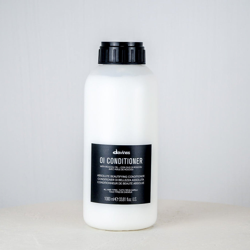 Jar of DANDY conditioner on a white background